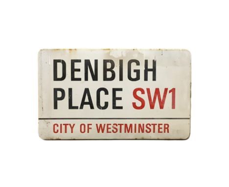 An enamelled steel street sign for Denbigh Place SW1, City of Westminster with iconic black and red sans serif lettering firs