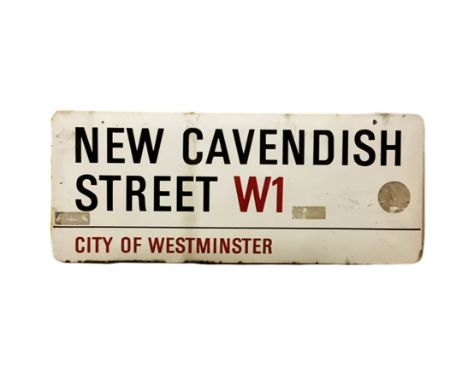 An enamelled steel street sign for New Cavendish Street W1, City of Westminster with iconic black and red sans serif letterin