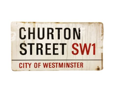 An enamelled steel street sign for Churton Street SW1, City of Westminster with iconic black and red sans serif lettering fir