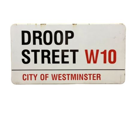 An enamelled steel street sign for Droop Street W10, City of Westminster with iconic black and red sans serif lettering first