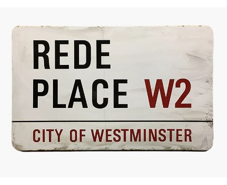 An enamelled steel street sign for Rede Place W2 City of Westminster with iconic black and red sans serif lettering first cre