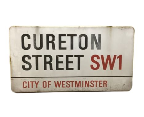 An enamelled steel street sign for Cureton Street SW1, City of Westminster with iconic black and red sans serif lettering fir