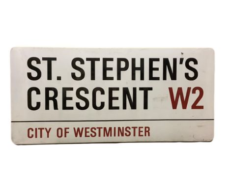 An enamelled steel street sign for St. Stephen's Crescent W2, City of Westminster with iconic black and red sans serif letter