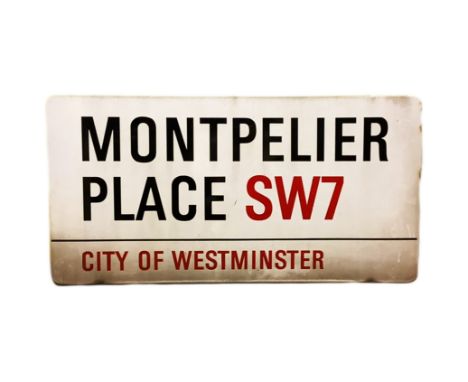 An enamelled steel street sign for Montpelier Place SW7, City of Westminster with iconic black and red sans serif lettering f