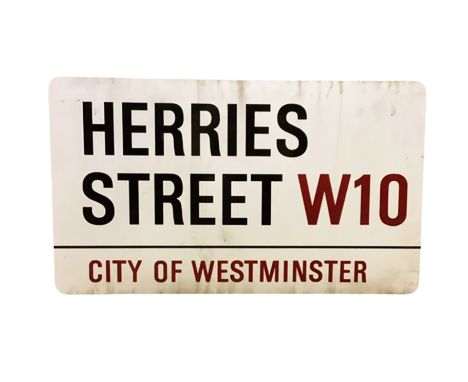 An enamelled steel street sign for Herries Street W10, City of Westminster with iconic black and red sans serif lettering fir