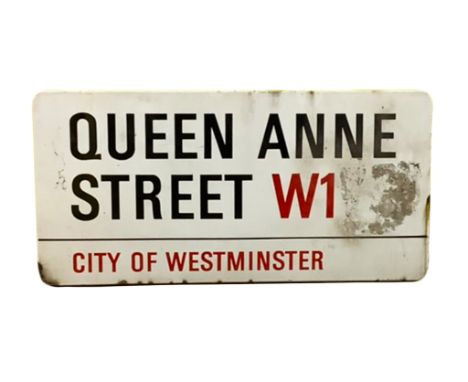 An enamelled steel street sign for Queen Anne Street W1, City of Westminster with iconic black and red sans serif lettering f