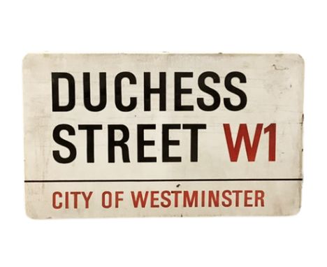 An enamelled steel street sign for Duchess Strees W1, City of Westminster with iconic black and red sans serif lettering firs