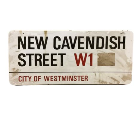 An enamelled steel street sign for New Cavendish Street W1, City of Westminster with iconic black and red sans serif letterin