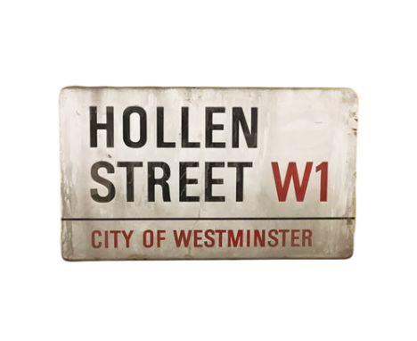 An enamelled steel street sign for Hollen Street W1, City of Westminster with iconic black and red sans serif lettering first