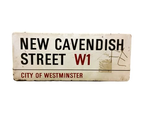 An enamelled steel street sign for New Cavendish Street W1, City of Westminster with iconic black and red sans serif letterin