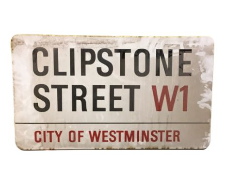 An enamelled steel street sign for Clipstone Street W1, City of Westminster with iconic black and red sans serif lettering fi