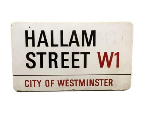An enamelled steel street sign for Hallam Street w1, City of Westminster with iconic black and red sans serif lettering first