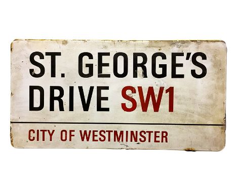 An enamelled steel street sign for St. George's Drive SW1, City of Westminster with iconic black and red sans serif lettering
