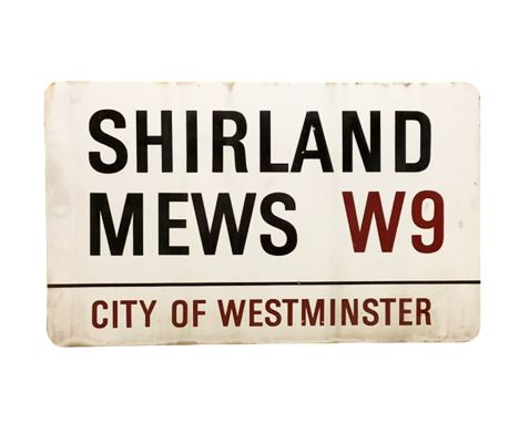 An enamelled steel street sign for Shirland Mews W9, City of Westminster with iconic black and red sans serif lettering first
