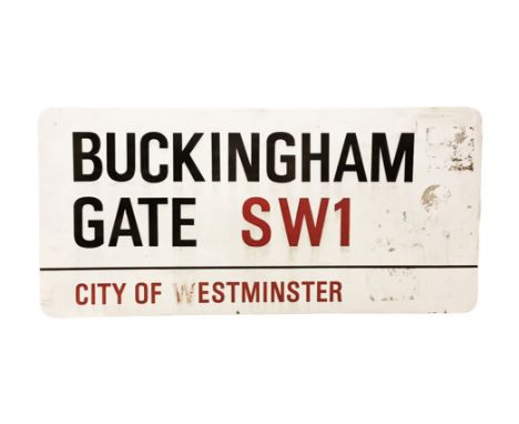 An enamelled steel street sign for Buckingham Gate SW1, City of Westminster with iconic black and red sans serif lettering fi