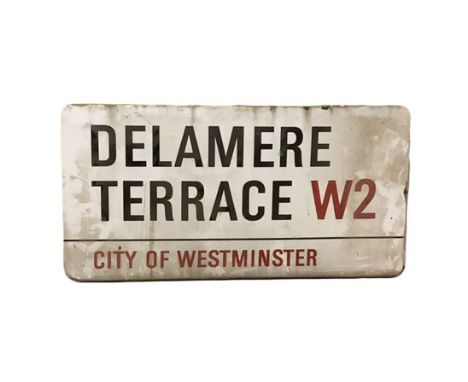 An enamelled steel street sign for Delamere terrace W2, City of Westminster with iconic black and red sans serif lettering fi