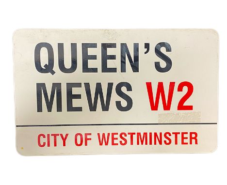 An enamelled steel street sign for Queen's Mews W2 City of Westminster with iconic black and red sans serif lettering first c