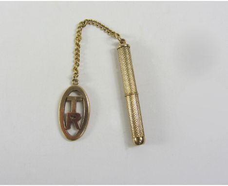 Gold engine turned toothpick hallmarked 9ct with fob and chain stamped 9ct,  approx 11gr Condition Report Click here for furt