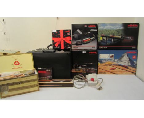 Marklin mini series (Z gauge) five boxed train sets, two track controllers (one boxed), four boxed spare track, three cigar b