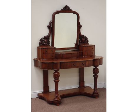 Late Victorian mahogany serpentine Duchess dressing table fitted with single drawer, four trinket drawers, hinged centre comp