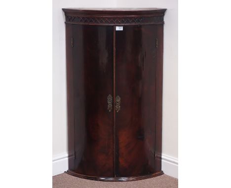 Early 19th century figured mahogany bow front corner cabinet, strapwork decoration, W60cm, H100cm Condition Report Click here