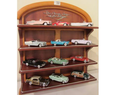 Classic cars of the 50's, twelve cars all boxed, display shelf (boxed) with collectors book and folder (15) Condition Report 