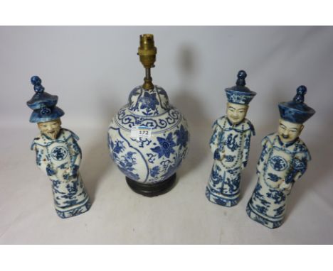 Three Chinese scholars and a Chinese blue and white lamp base with wooden stand  Condition Report Click here for further imag