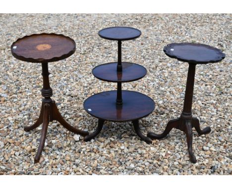 A mahogany three tier afternoon tea stand, 58 cm high to/w two tripod wine tables (a/f) (3) 