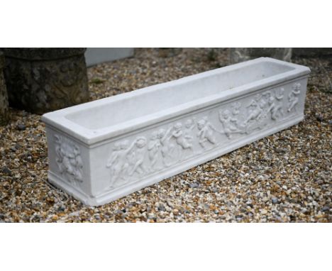 An antique style marble trough planter with relief cut frieze depicting a procession of frolicking cherubs 