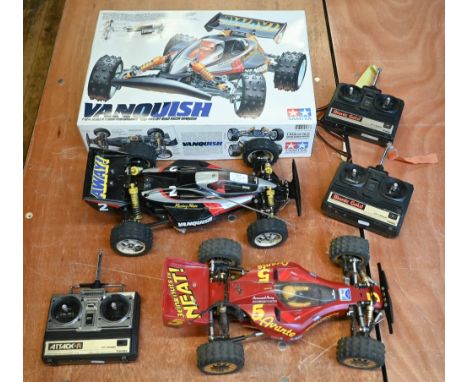 A high performance Tamiya Vanquish 1/10th scale four wheel drive remote control off road racing car, boxed with spare batteri