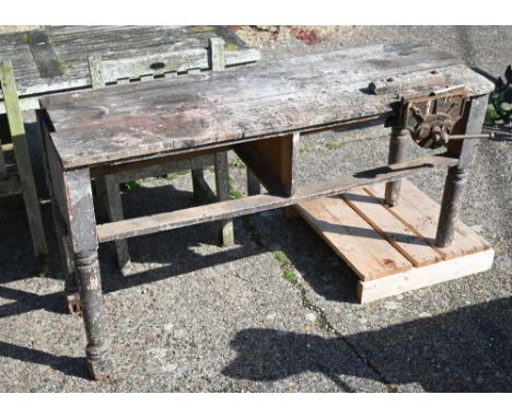 A well-used pine work bench with 'Record' vice, 150 x 55 x 82 cm high (very a/f), to/w vintage wooden double extension ladder