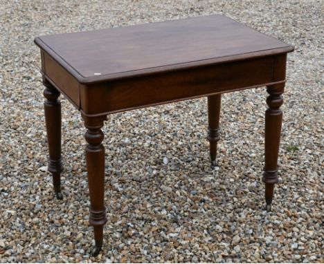 A 19th century mahogany console table with end drawers, turned supports and brass casters, 90 cm wide x 60 cm deep x 76 cm hi