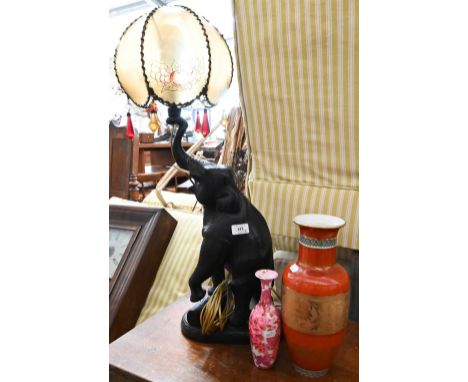 An ebonised carved wood elephant table lamp with acetate shade, to/w two Oriental vases (3) 