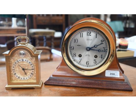 A Shreve, Crump &amp; Low Co 'Chelsea Ship's Bell' marine clock in 14 cm brass drum case with teak stand to/w a small Swiss b