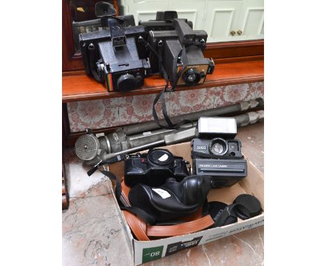 Three Polaroid cameras, a Cosina CS-1 SLR body and a tripod 