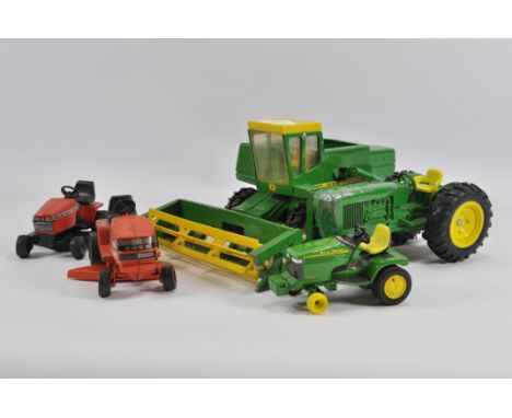 Group of 1/16 Scale Ertl Diecast Farm Models including 1/32 John Deere Combine, Tractor and Mower items. Generally Fair to Go