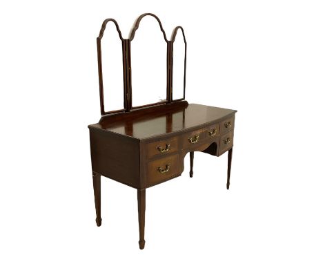 Early 20th century bow front mahogany dressing table, triple mirror back over five drawers, square tapering supports with spa