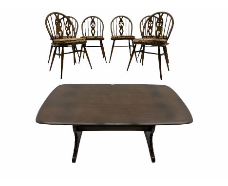 Ercol medium elm rectangular dining table and six hoop back chairsDimensions: Height:&nbsp;72cm&nbsp; Length/Width:&nbsp;150c