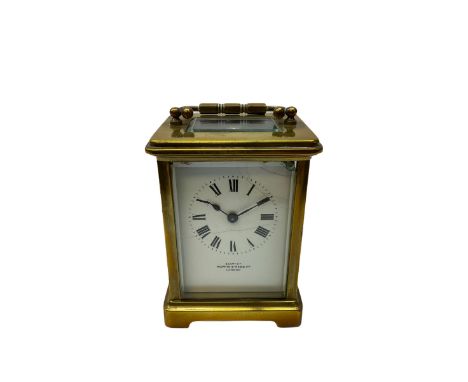 A Corniche cased 20th century timepiece carriage clock retailed by Mappin &amp; Webb, with a white enamel dial , Roman numera