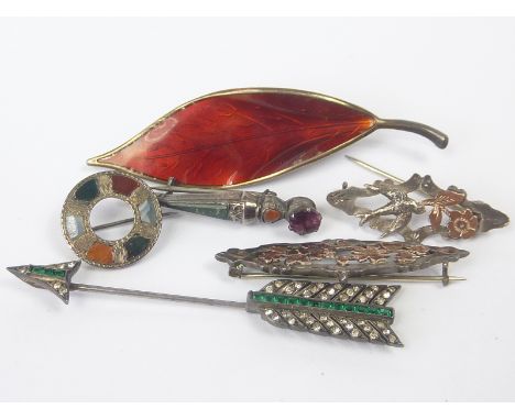 Norwegian enamelled silver leaf brooch, a French silver and paste jabot pin, two small Scottish pebble brooches and two other