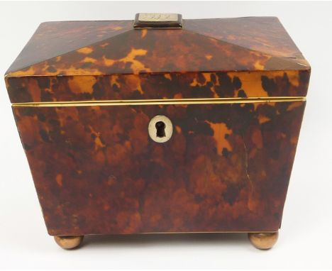 Georgian tortoiseshell tea caddy of sarcophagus form with inlaid stringing, white metal escutcheon and monogrammed panel  on 