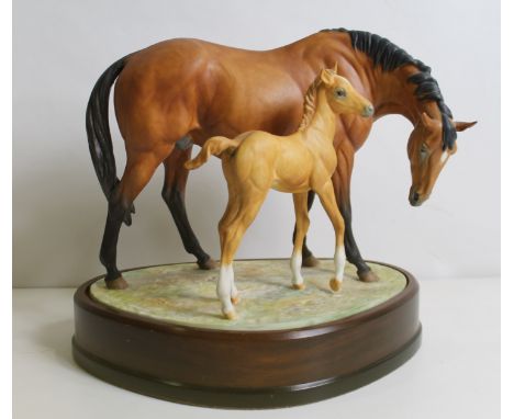 Royal Worcester porcelain figure group of horses "Prince's Grace and Foal" modelled by Doris Lindner, number 688 on wooden pl