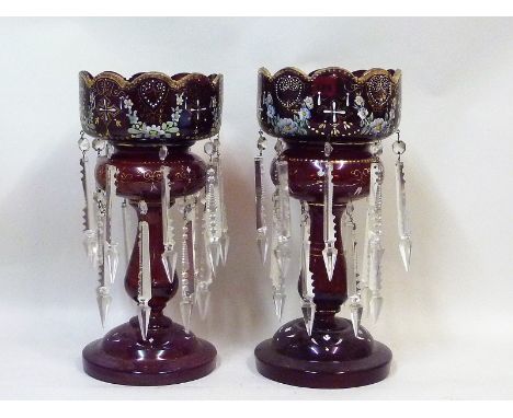 Pair of Bohemian ruby glass table lustres with polychrome enamel and gilt painted floral and scroll decoration each with sixt