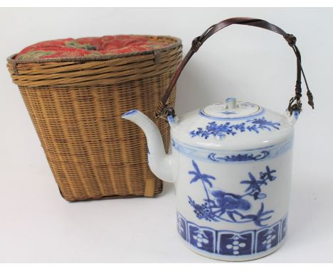Antique Chinese blue and white teapot with floral decoration and woven handle, in fitted basket case, 15cm high.