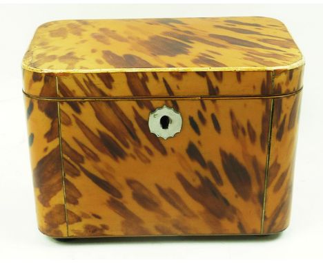 Georgian tortoiseshell tea caddy of rounded rectangular form with inlaid stringing white metal escutcheon on four ebonised bu