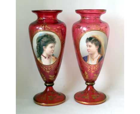 Pair of 19th century Bohemian cranberry glass vases of baluster form each with applied hand painted oval portrait panel of a 