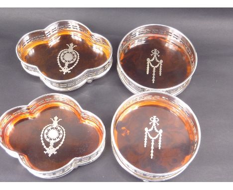 Pair of e.p. decanter stands, inlaid decoration and another of lobed oval section. (4)