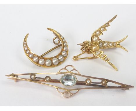 Gold and pearl brooch modelled as a swallow, another, a crescent and a pearl and aquamarine bar brooch, 9/15ct. (3).   Condit