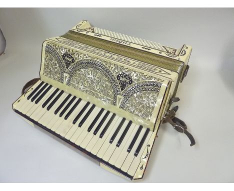 Suttimio Soprani piano accordion, 51cm wide, cased.   Condition Report.  Seems to make a noise! Not an accordion player!Some 