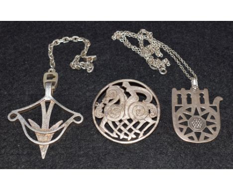 A Scottish hallmarked Shetland brooch; pendant on a neckchain; arrow pendant